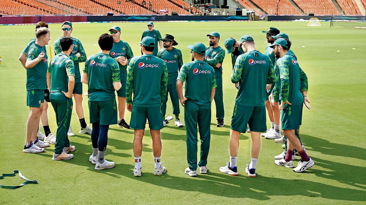 Pakistan players in a huddle prior to their practice session yesterday