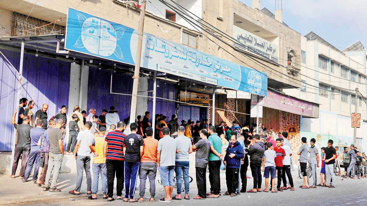 People queue in front of a bakery in Rafah in the southern Gaza Strip. Pics/AP