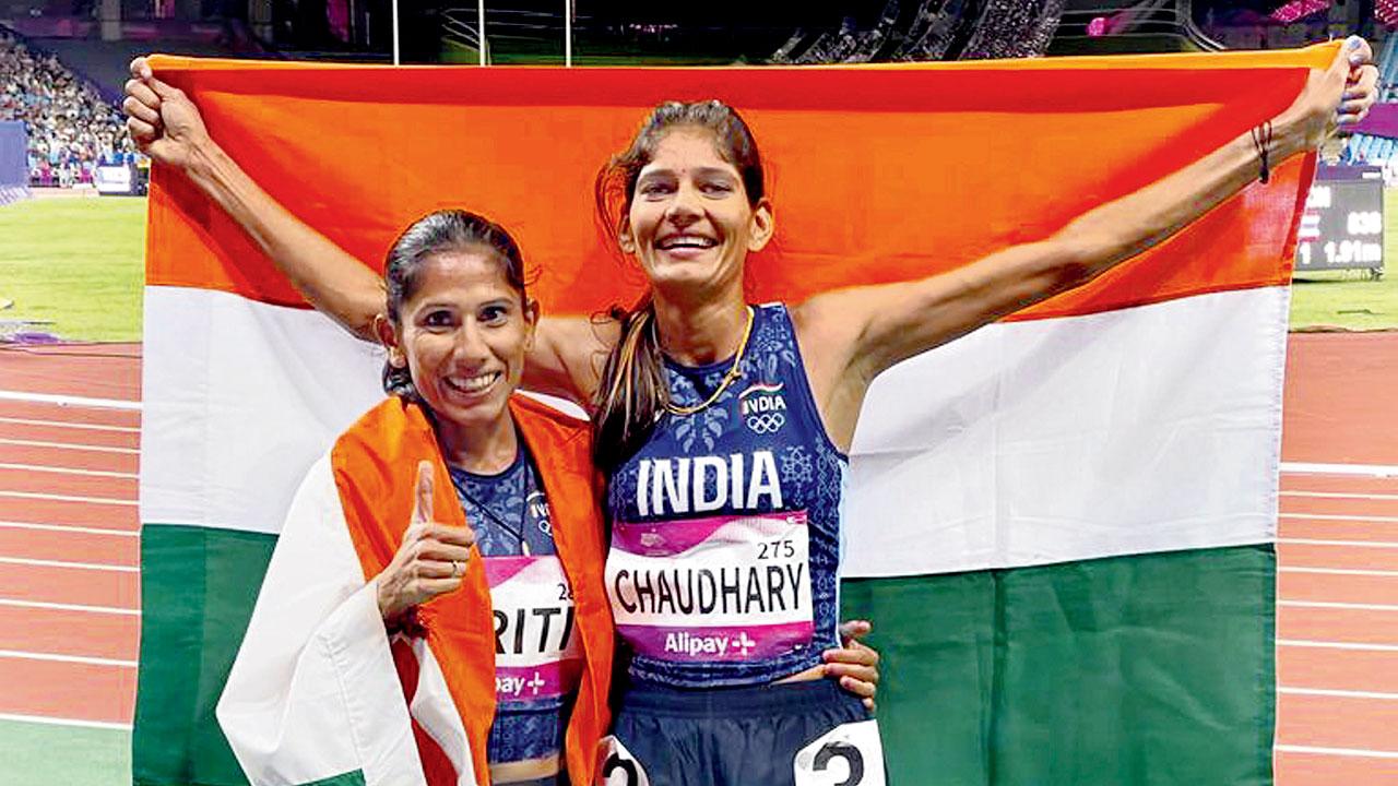 Parul Chaudhary (right) and Priti Lamba celebrate after winning the silver and bronze medals respectively yesterday. Pics/PTI
