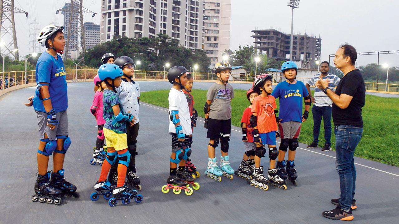 Skating instructor Ajay Shivlani briefs his students in between sessions