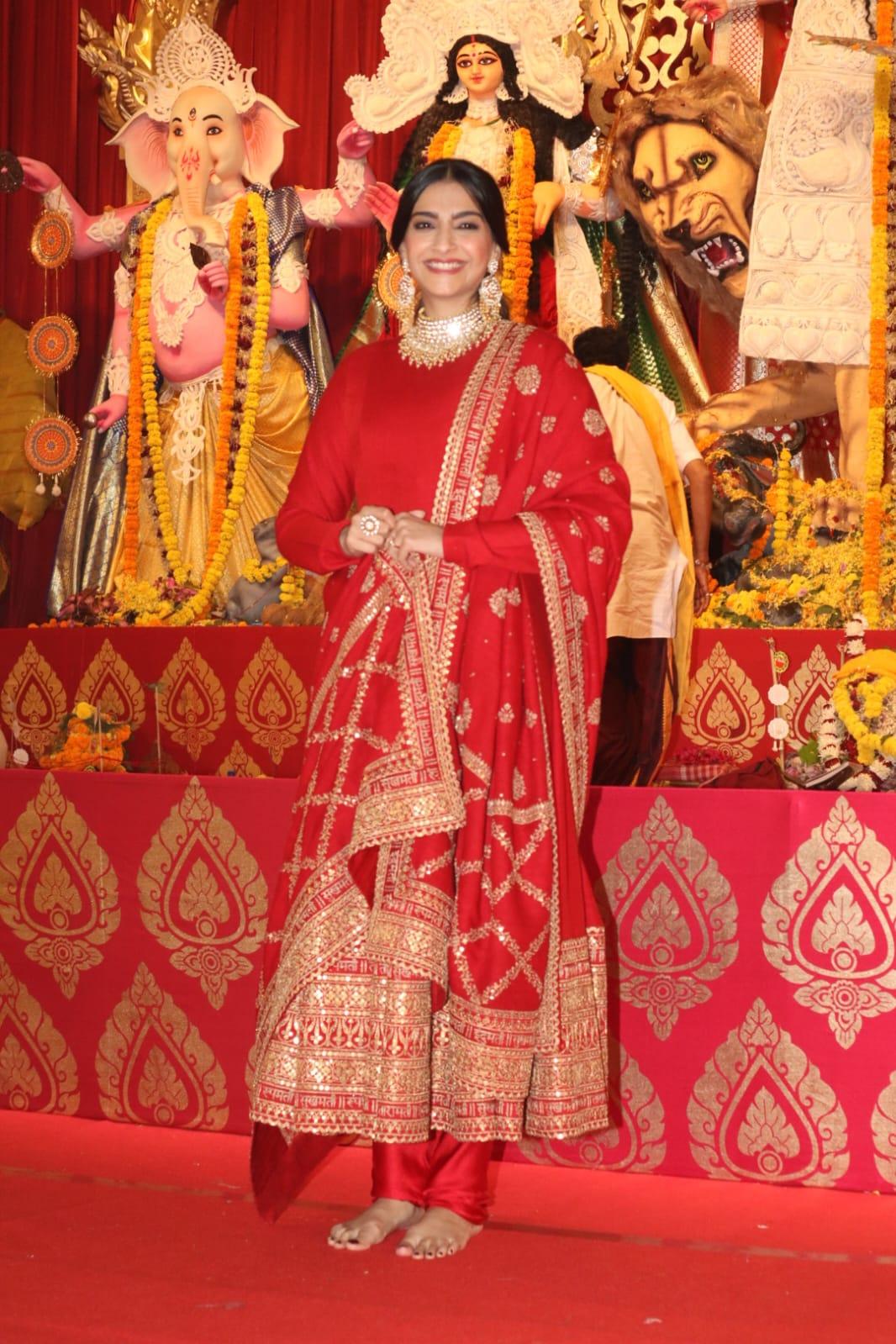 Sonam Kapoor looked stunning as she opted for a heavily embroidered red suit while visiting the Durga Puja pandal in Juhu