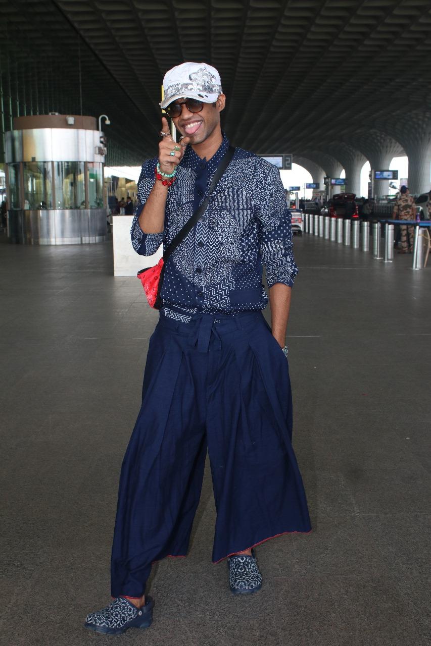 Babil Khan was spotted at the airport wearing a blue wide-legged bottoms paired with matching printed shirts