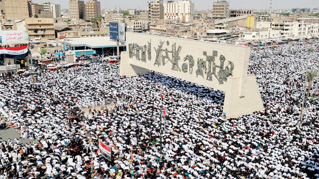 People gather to perform the weekly Muslim Friday prayers at Baghdad’s Tahrir Square during an anti-Israel demonstration. Pic/AP