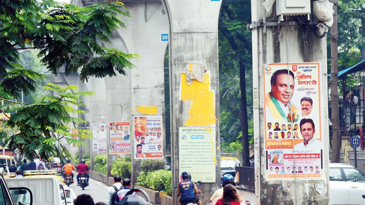 Political posters on monorail pillars at GD Ambekar Road, Bhoiwada in Parel on Sunday. Pic/Satej Shinde