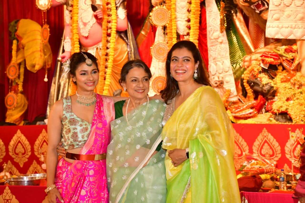 Kajol and Tanishaa posed with their mother Tanuja at their family's Durga Puja pandal