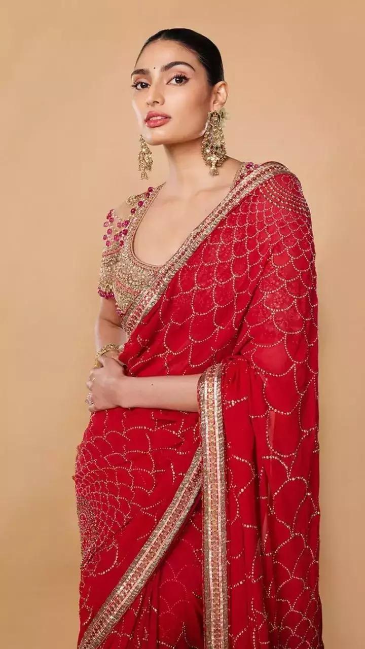 If you're a saree person, Athiya served the right style inspiration in a red saree paired with a golden blouse