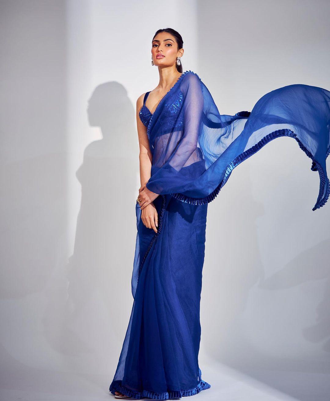 Athiya Shetty looked ethereal in a blue sheer saree that accentuated her beauty.