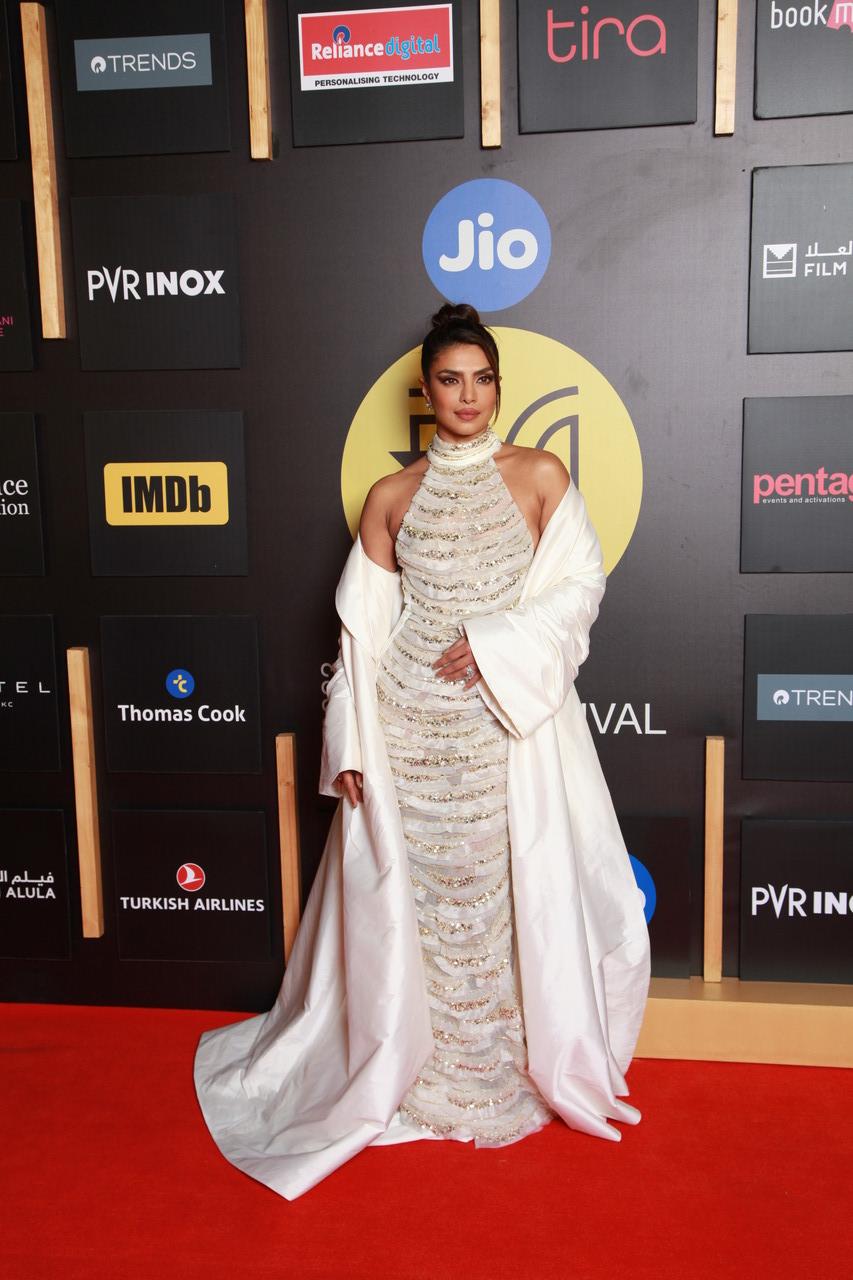 Priyanka Chopra aced the red carpet look in a sheer white gown with a long overcoat