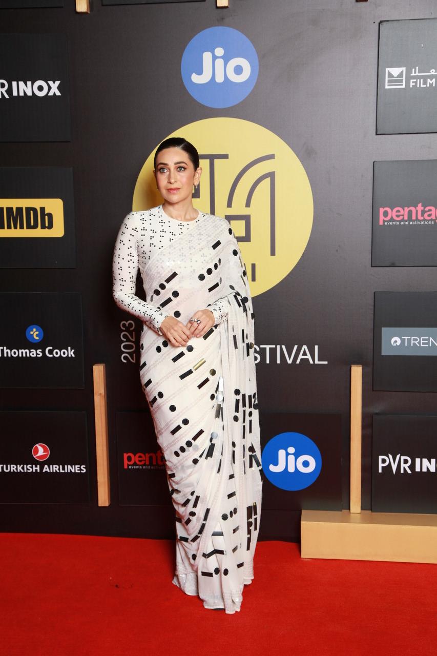 Karisma Kapoor mesmerised in a white saree with shiny silver stripes