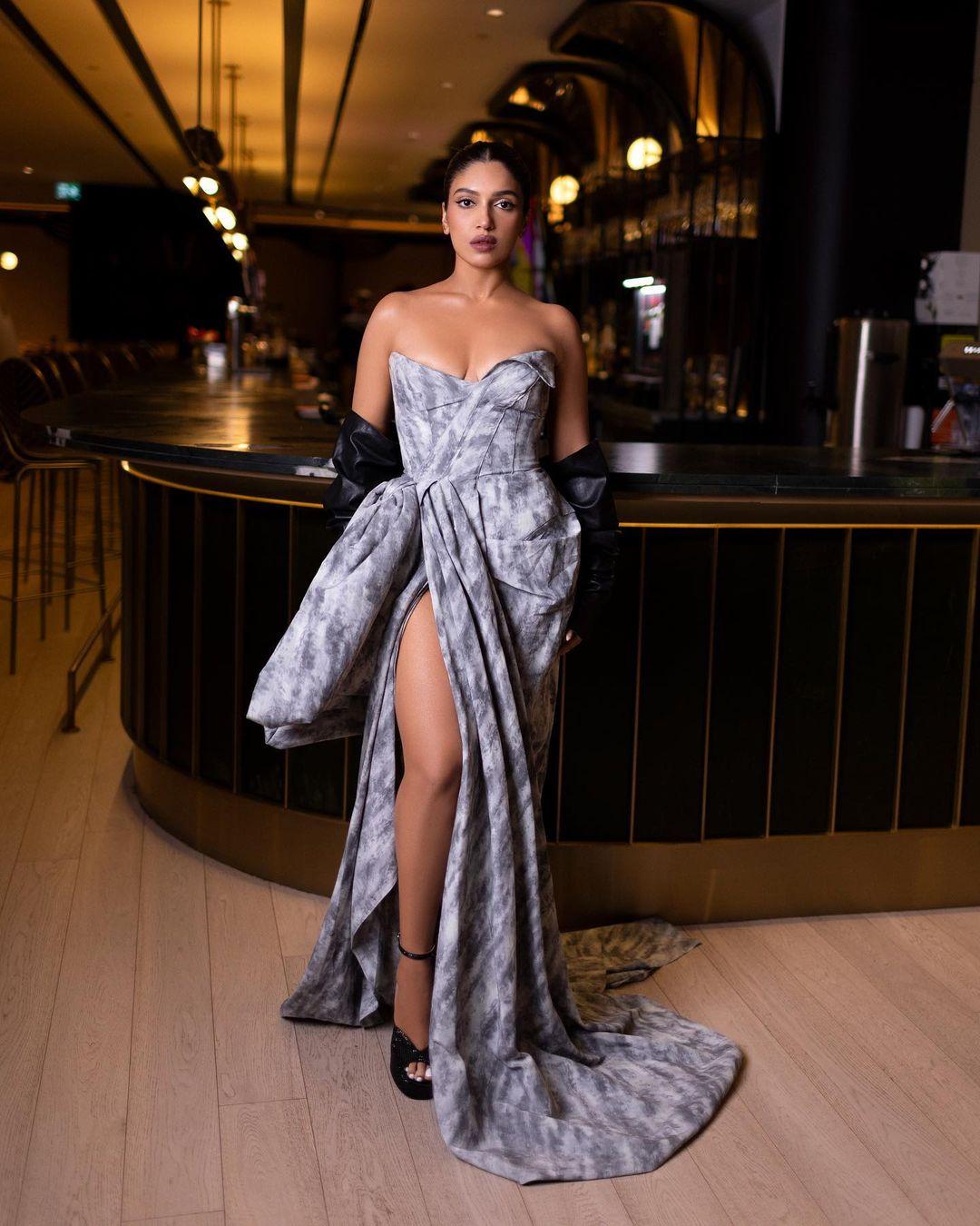 The talented actress dazzled in an exquisite gown from the luxury clothing brand, Toni Maticevski. The gown boasted a plunging neckline, a tailored bodice, an eye-catching oversized bow pattern at the waist, and a daring thigh-high slit, adding a dash of allure to her ensemble. 