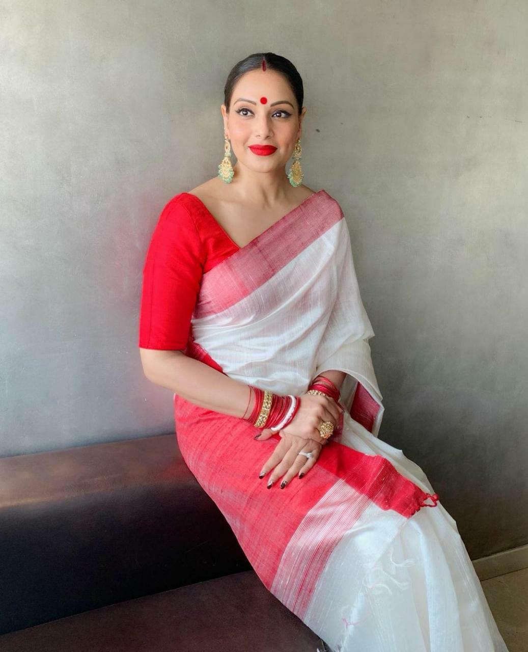 Bipasha Basu's beautiful outfit, with a red and white saree and a bold red bindi on her forehead, is a wonderful pick for Dashami.