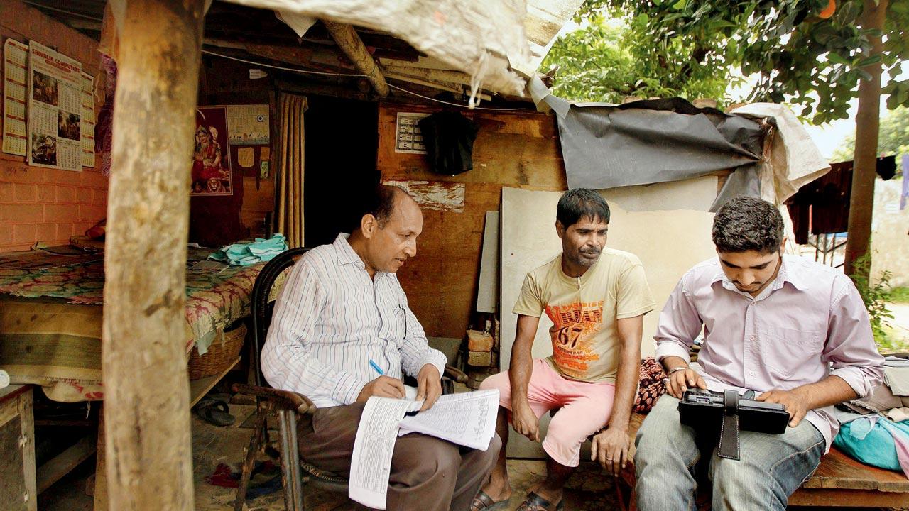 A washerman, hailing from the Dhobi caste, being interviewed by census officials during Bihar’s recent caste census. Pic/Getty Images