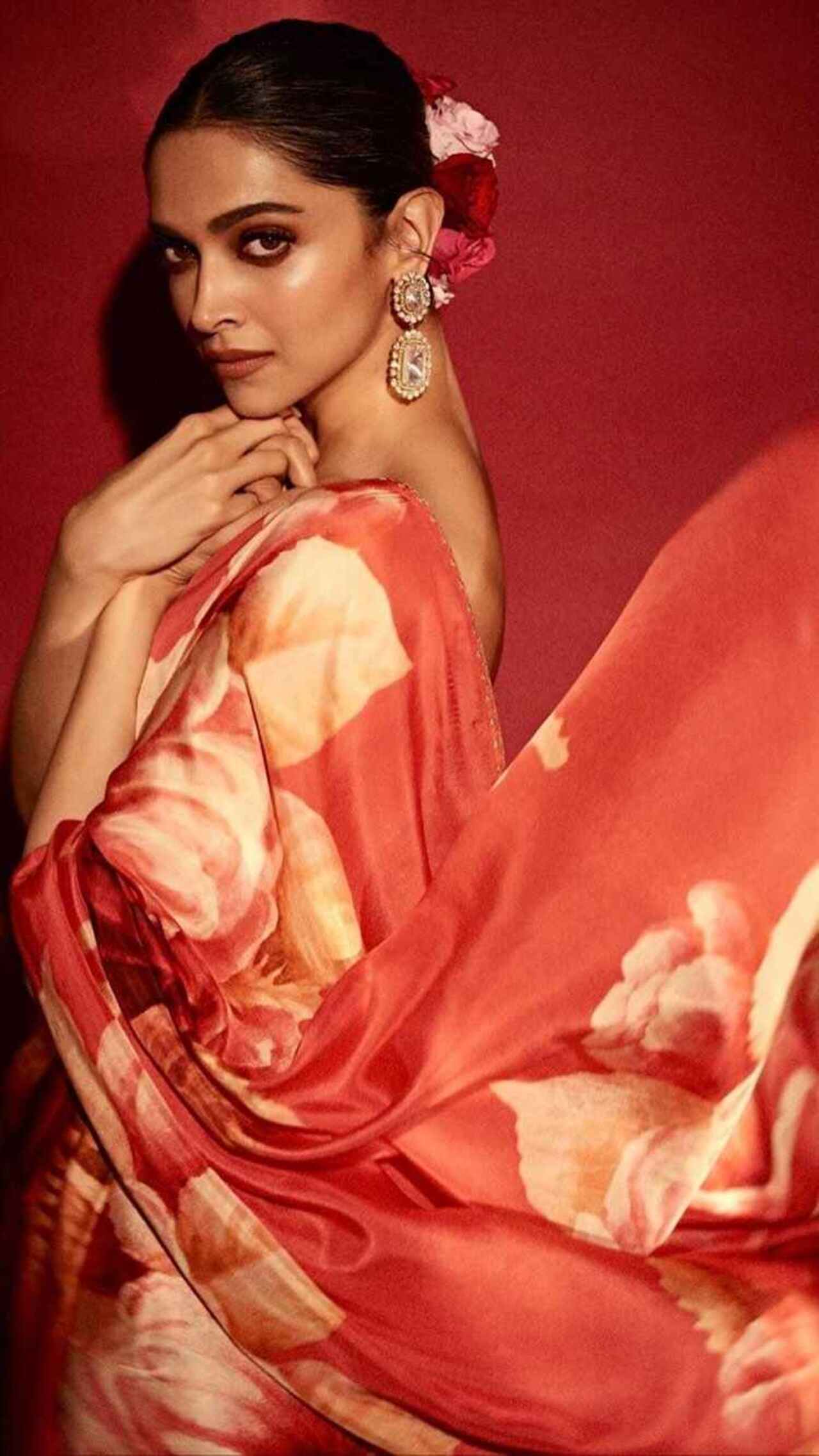 Day 2 (Red): Deepika Padukone wore a floral printed red saree for an event. Painting a royal picture, the actress completed her look with statement earrings and a bun adorned with flowers