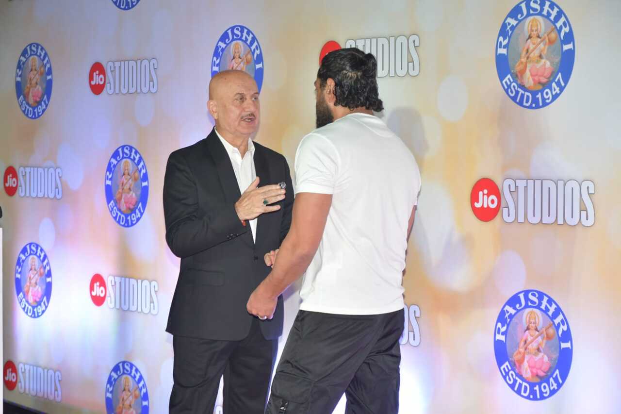 Bobby Deol and Anupam Kher have a chat as they meet at the red carpet