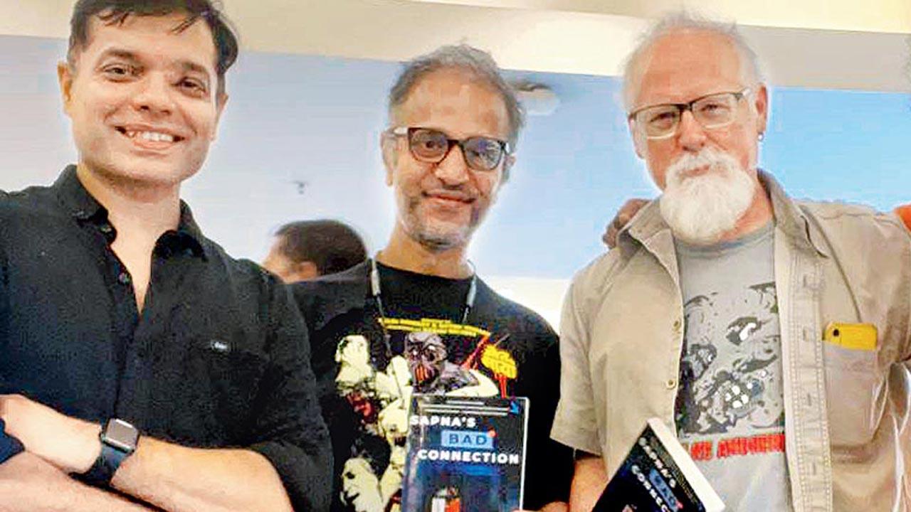 Neil D’Silva and friend with (right) Tim Paxton