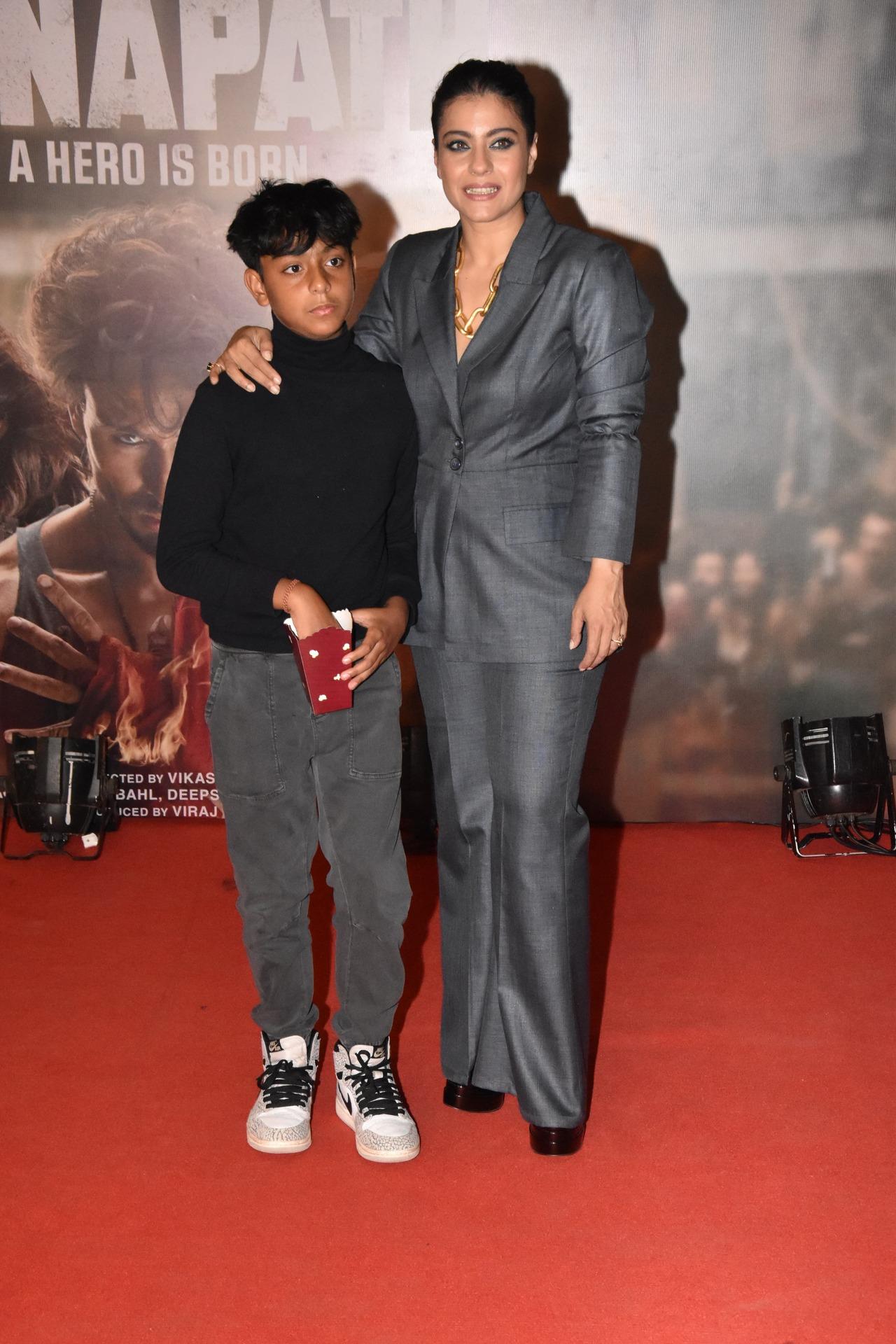 Kajol was accompanied by her younger son Yug. While Yug munched on popcorn at the red carpet, mother Kajol posed with him dressed in a grey pantsuit