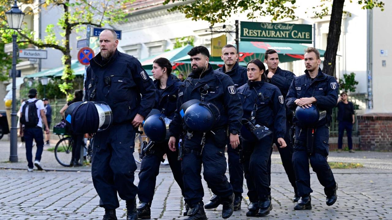 Police officers stand guard to make sure a banned demonstration in support of Palestinians does not take place, at Richardplatz, Neukoelln, Berlin on October 11, 2023. Pics/AFP