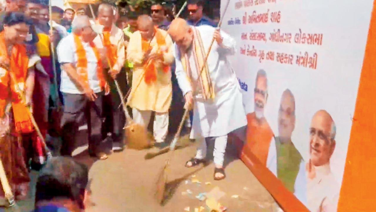 Guj CM, Amit Shah participate in A’bad cleanliness drive