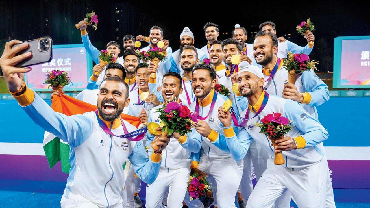 Veteran hockey goalkeeper PR Sreejesh takes a selfie as India players display their gold medals yesterday. Pic/PTI