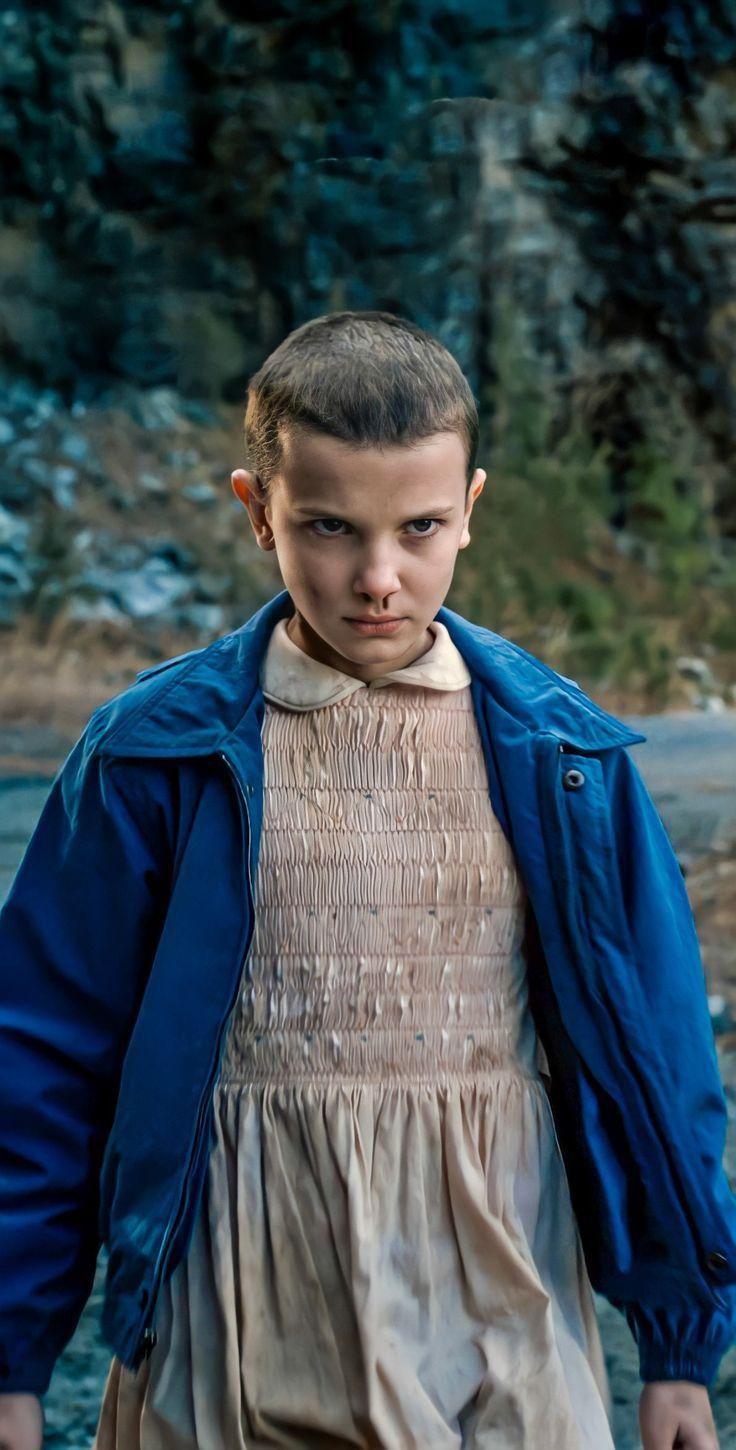 Eleven from Stranger Things is an easy look to cover. All you need is an old dress paired with a blue jacket 