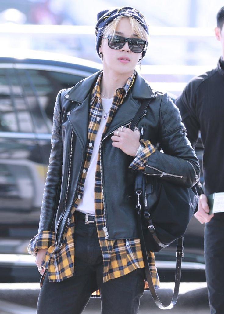 He's not afraid to rock black jeans with a white undershirt and a yellow flannel overshirt, all topped off with a leather jacket. It's a blend of grunge and high fashion that only Jimin can pull off.