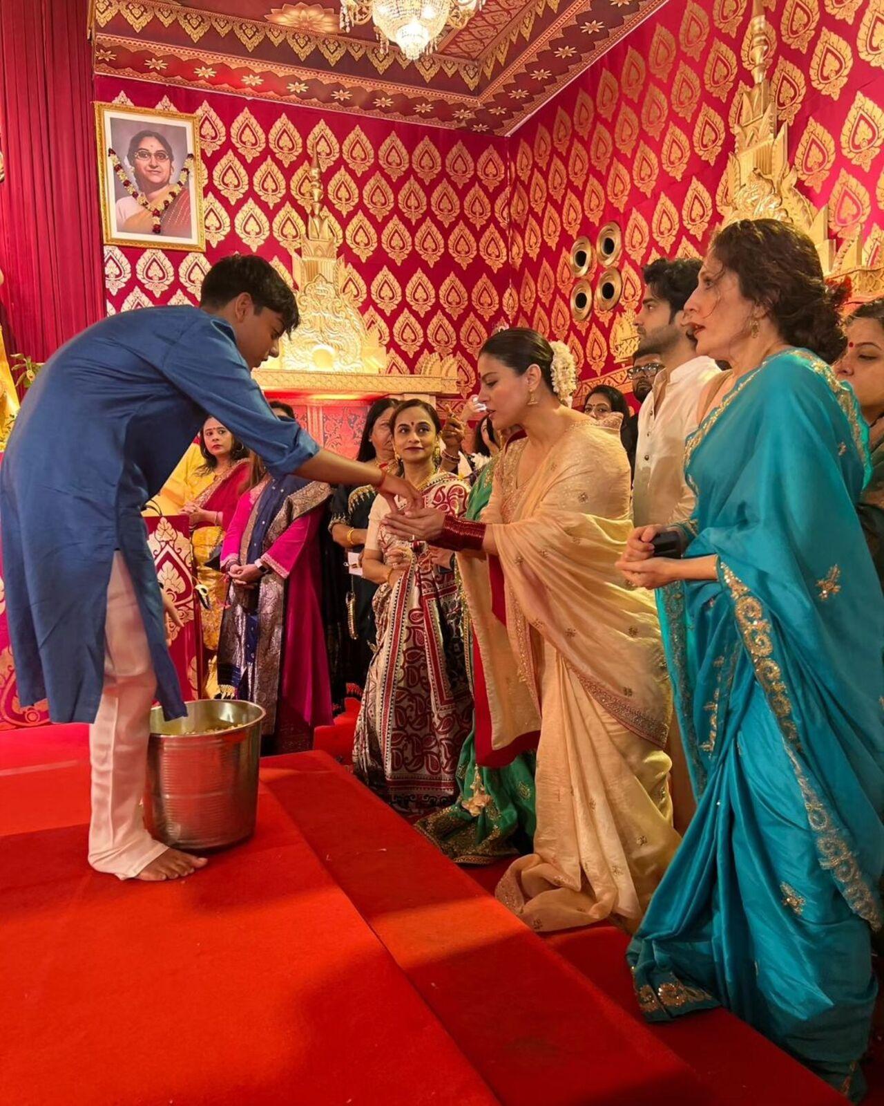 Through the festivity, Kajol's son Yug was seen accompanying her and soaking in their tradition and culture