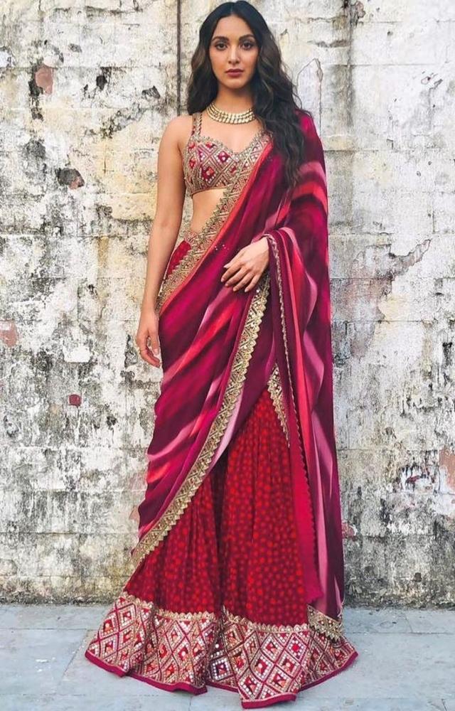 Kiara Advani dressed in a deep pink lehenga-style saree with an embroidered blouse. She wore the Arpita Mehta outfit for the promotions of Laxmmi