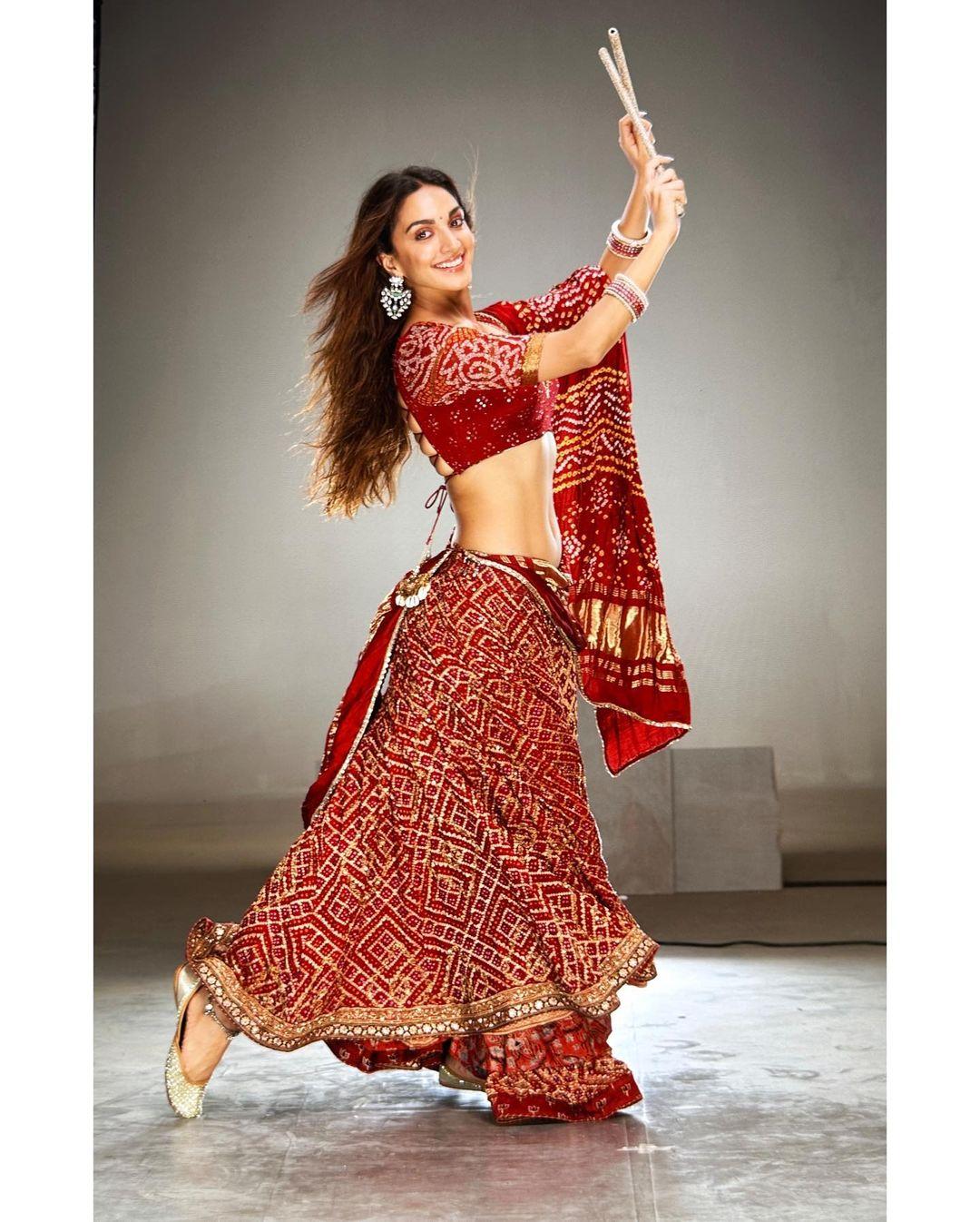 Kiara Advani, for the film 'Satyaprem Ki Katha', donned a striking red chaniya choli that has left fashion enthusiasts in awe. With exquisite embroidery and a rich red palette, her lehenga looks have consistently caught the discerning eye of fashion critics. She effortlessly embodies elegance and tradition, making her a style icon for Navratri fashion.