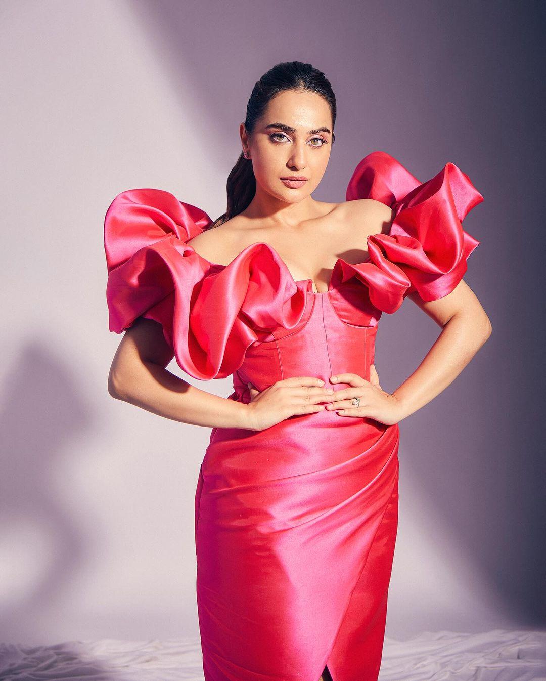 Kusha Kapila made quite the statement in a glossy pink dress that hugged her figure elegantly. The dress featured dramatic balloon sleeves, adding a touch of dramatic flair to her overall look. 
