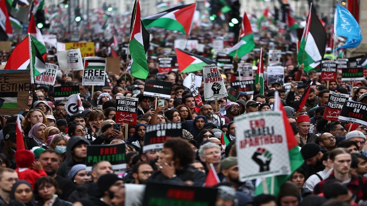 People take part in a 'March For Palestine', in London on October 21, 2023, to 