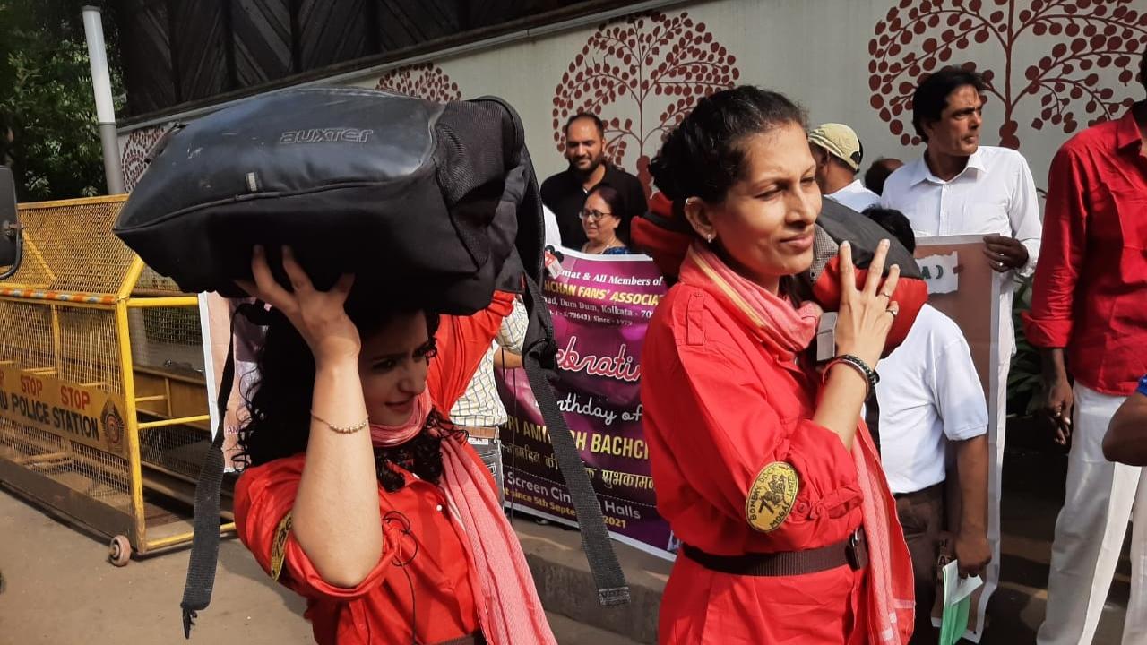 Women fans donned 'coolie' attire as they stood outside his residence