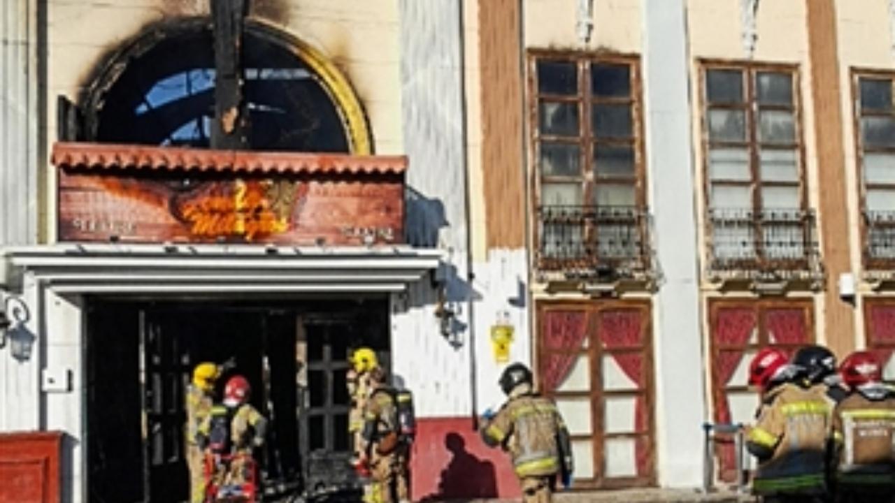The fire started around 6 a.m. in the popular Teatre nightclub (Pic/AFP)