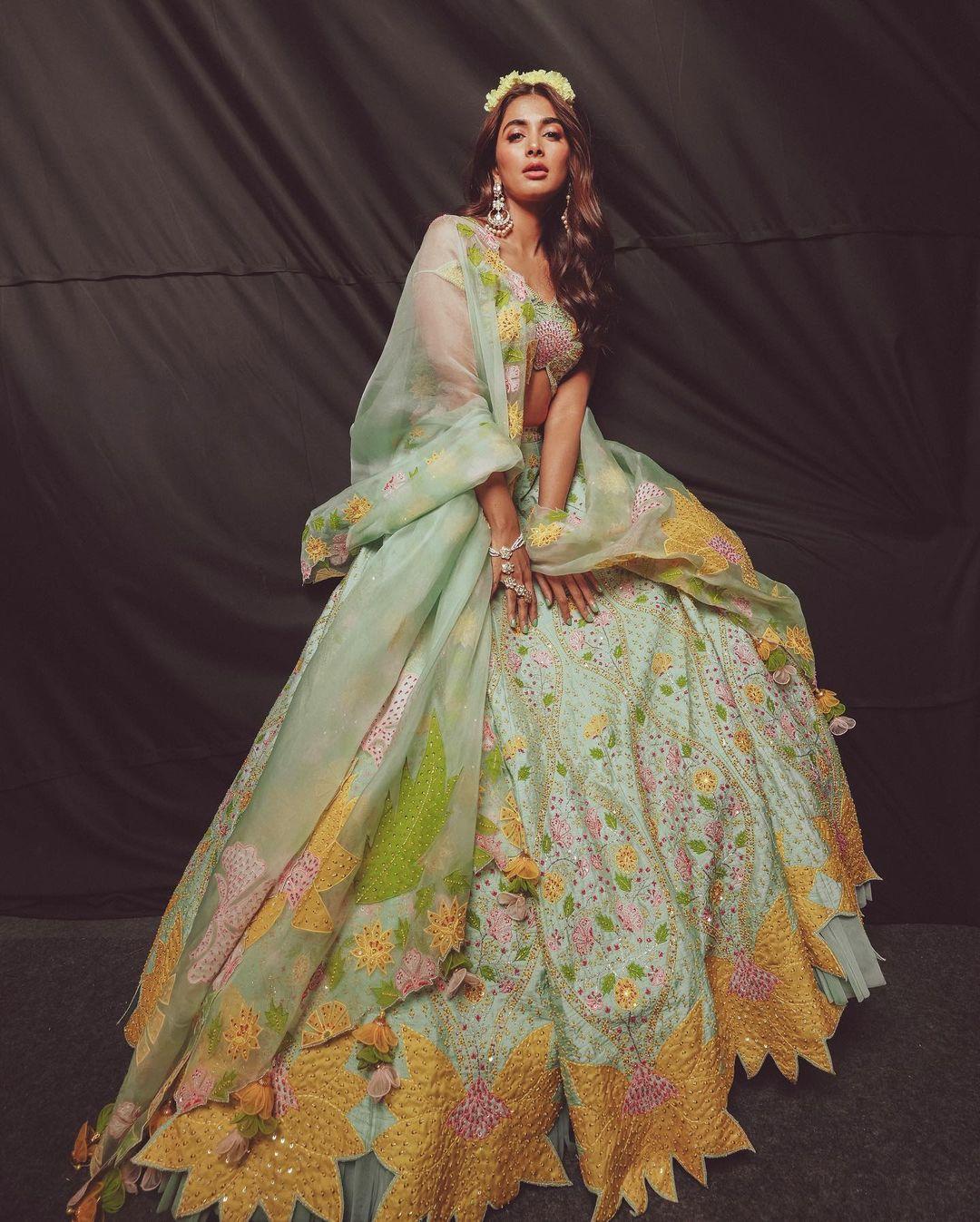Pooja Hegde's look was like a breath of fresh air in the rising heat. The Radhe Shyam actress appeared dreamy in her floral lehenga, radiating summer vibes with its lovely colors and flower patterns.