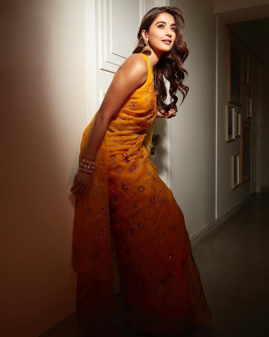 Hegde wowed us by wearing a gorgeous Tuscany yellow organza silk saree with intricate embroidery, leaving everyone truly impressed.