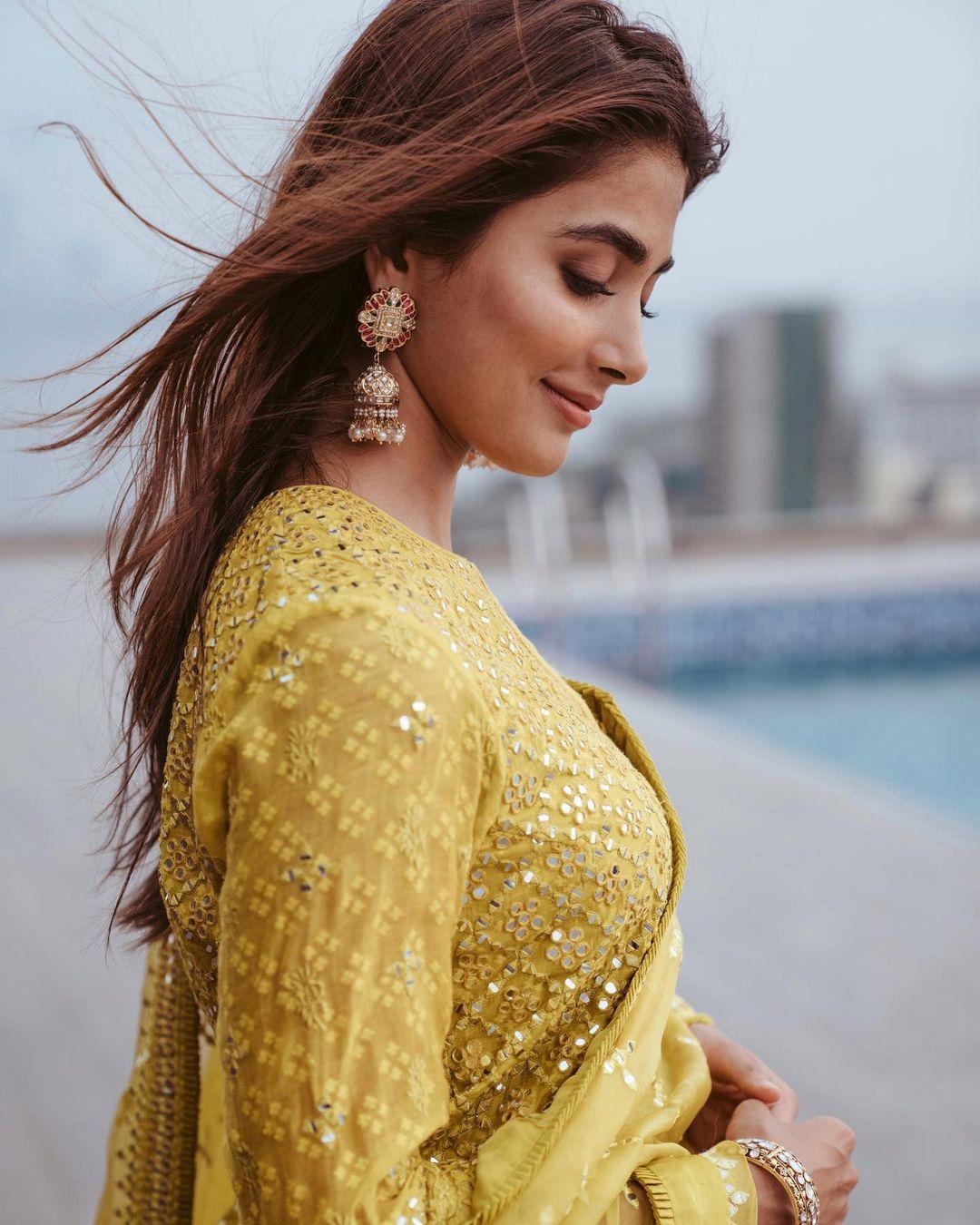 Pooja was the muse for fashion designer Archana Jaju, and she chose an ethnic outfit straight from the designer's collection. Pooja looked stunning in a vibrant yellow short kurta intricately embroidered with yellow resham threads.