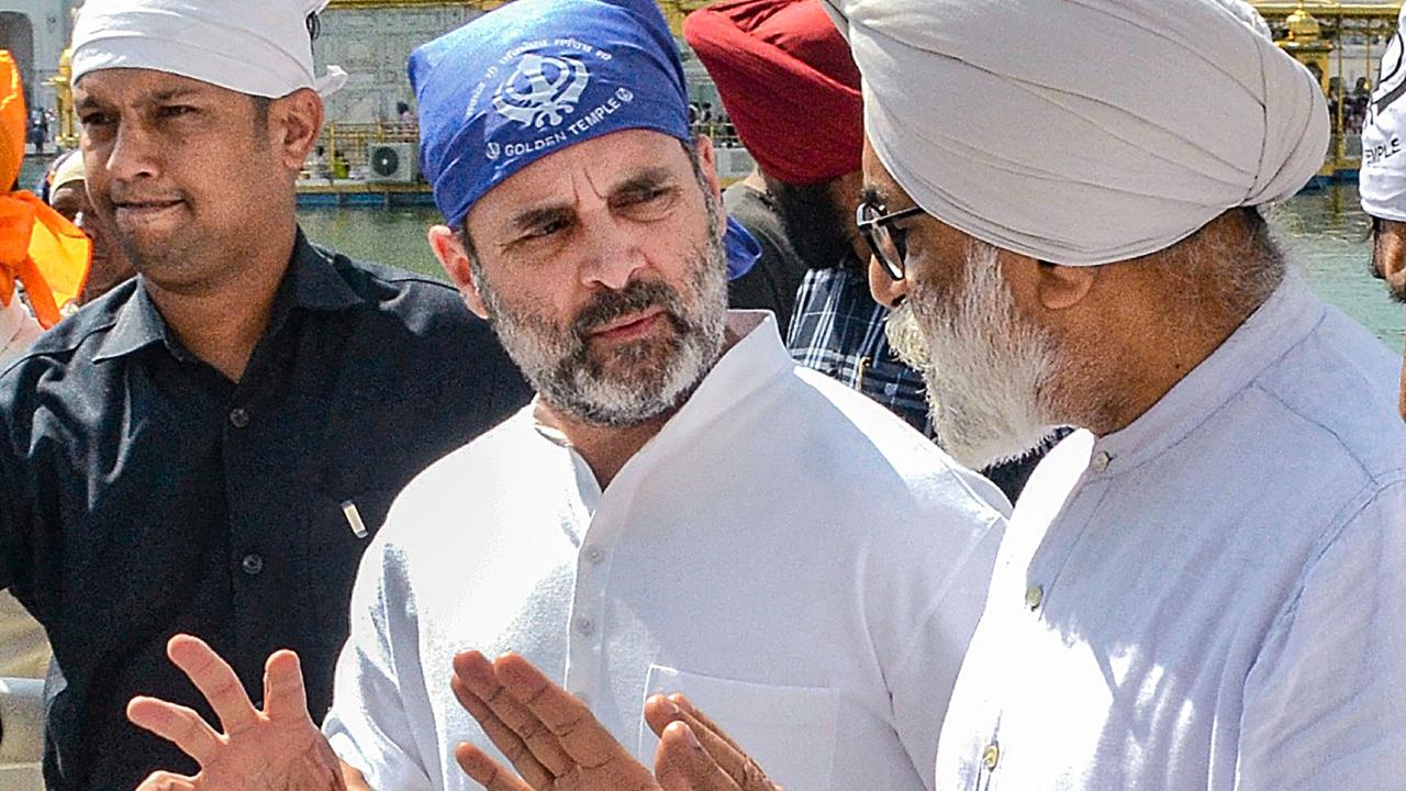 With his head covered by a blue cloth, the former Congress chief paid obeisance at the sanctum sanctorum of the Golden Temple