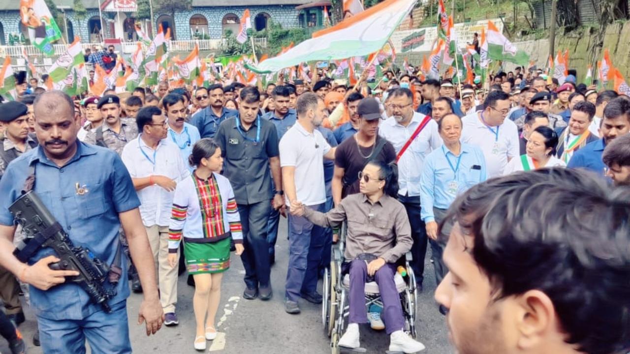 Rahul Gandhi walked through the winding roads of the city amid Congress supporters waving party flags