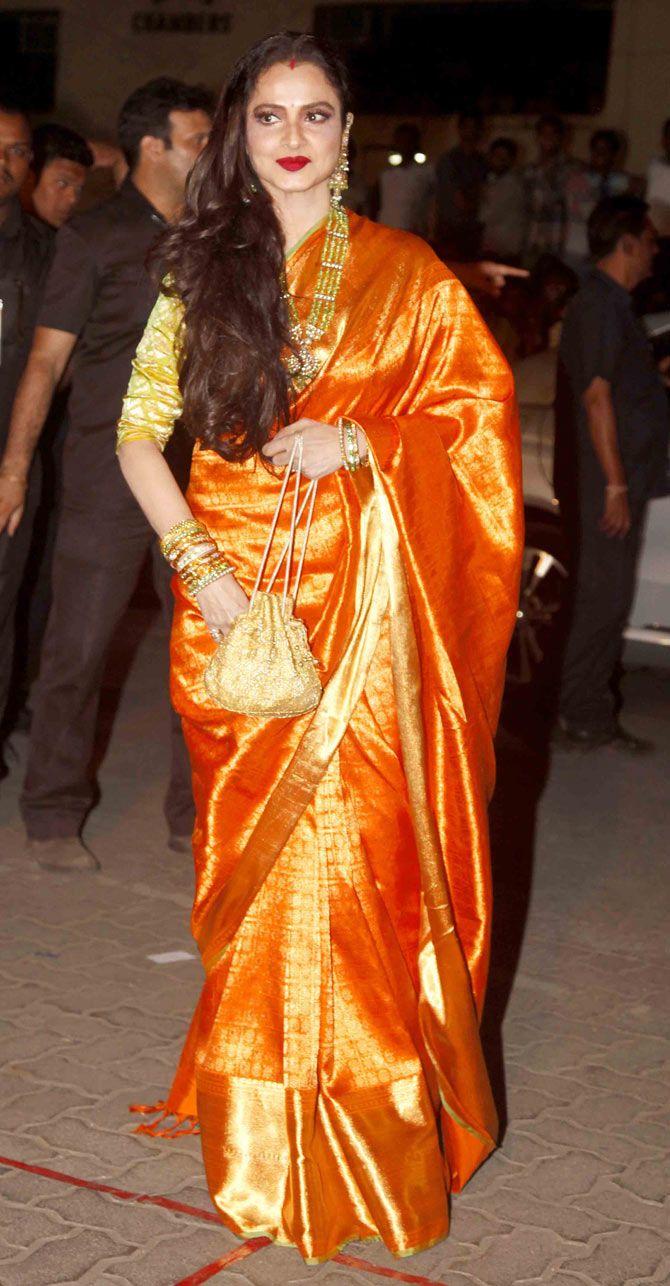 Rekha looked absolutely stunning in an orange Kanjeevaram saree that caught everyone's attention