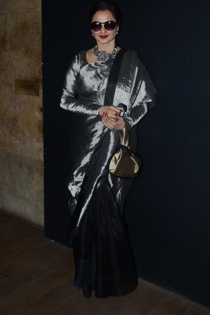 Rekha looked absolutely stunning in a beautiful grey pattu saree that oozed timeless elegance. What made her outfit even more chic was her choice to wear a pair of sleek black glasses