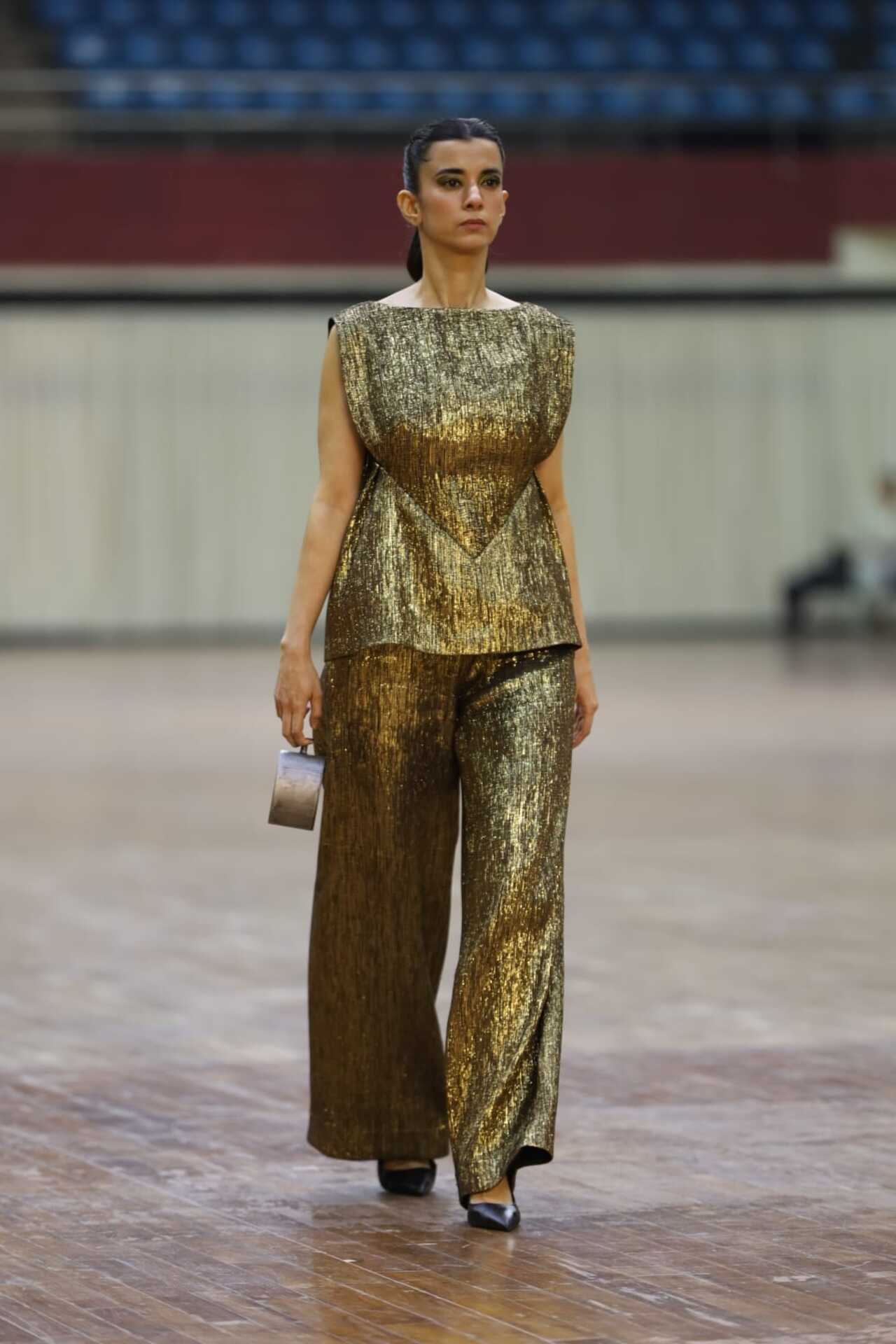 The actress wore flared pants with a peplum-style top