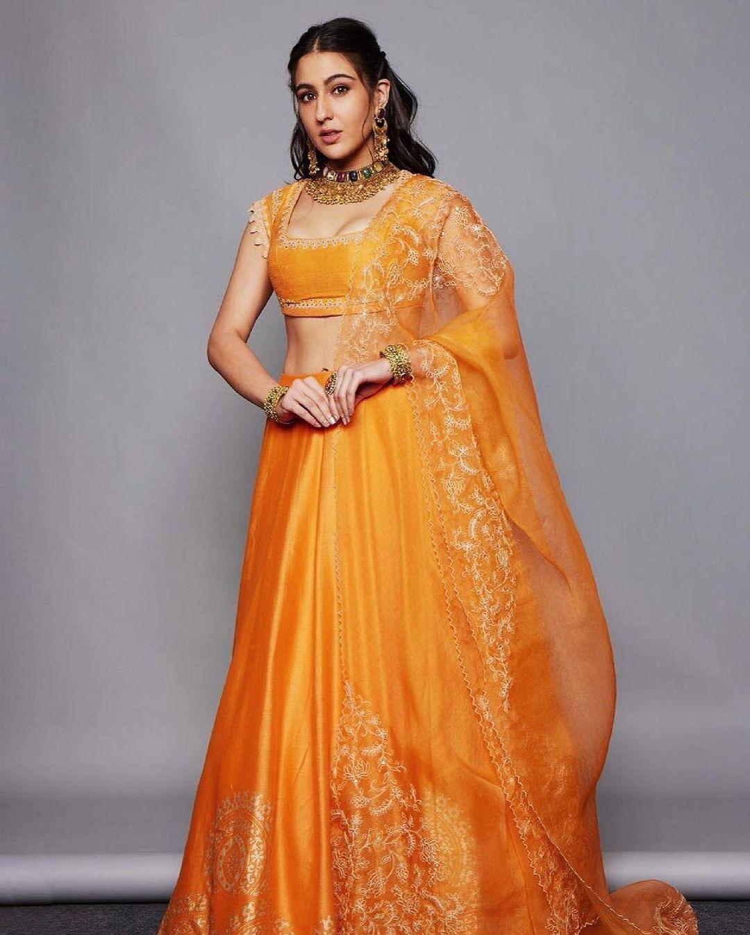 This lovely orange lehenga set is a true work of art. The skirt is crafted from delicate chanderi fabric and adorned with intricate hand block prints.