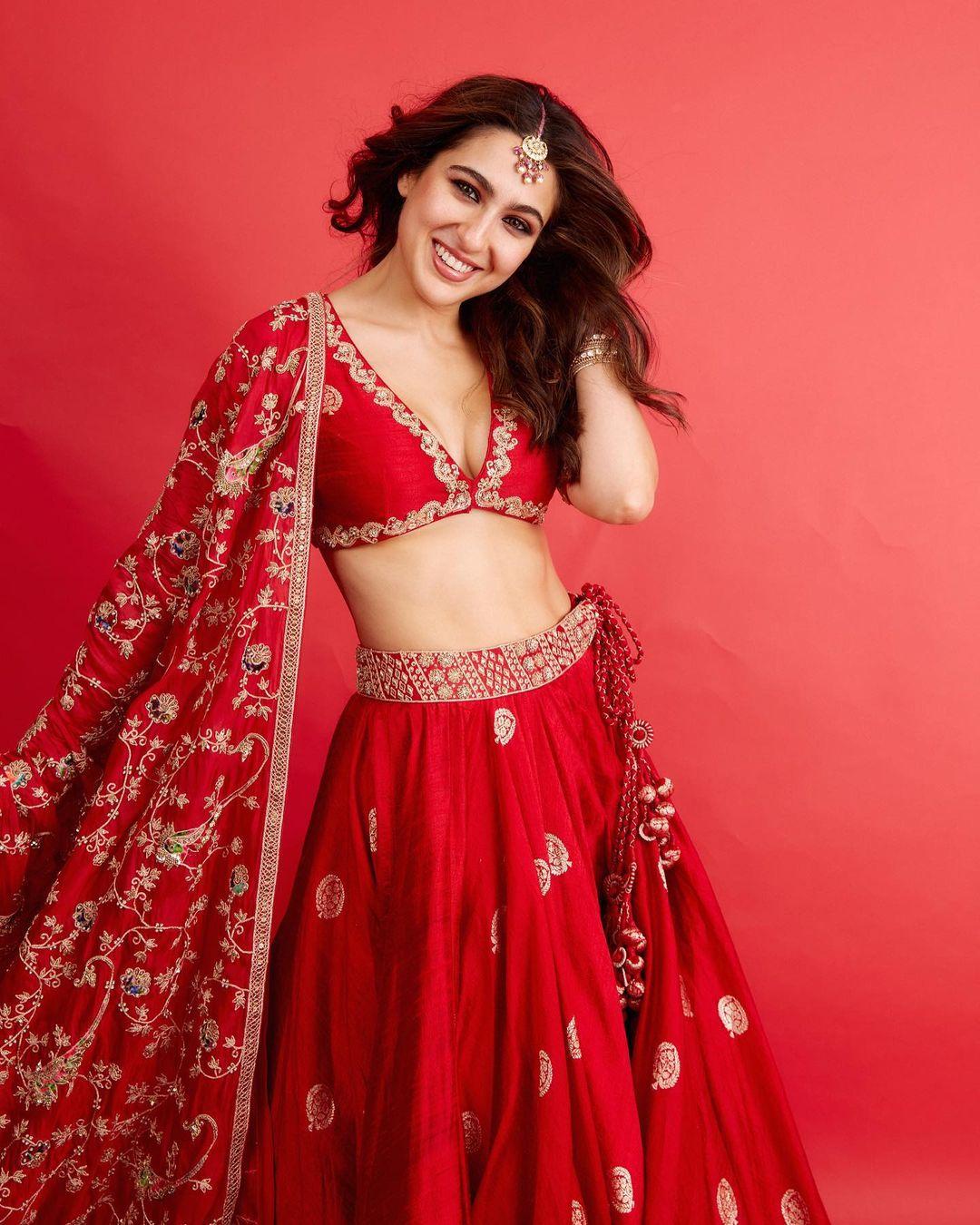 Sara Ali Khan embraced tradition in a red embroidered lehenga with a V-neckline blouse. 