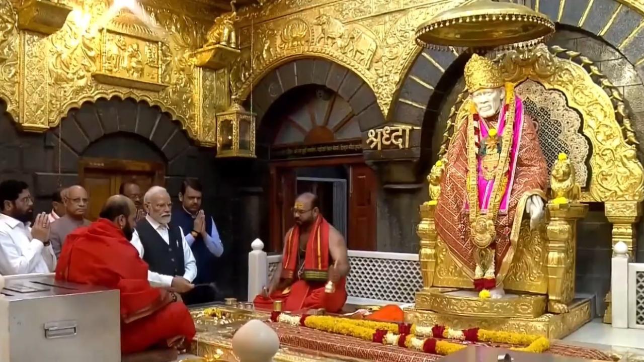 PM Modi on Thursday visited the Shri Saibaba Temple in Shirdi. Pics/CM Eknath Shinde/X