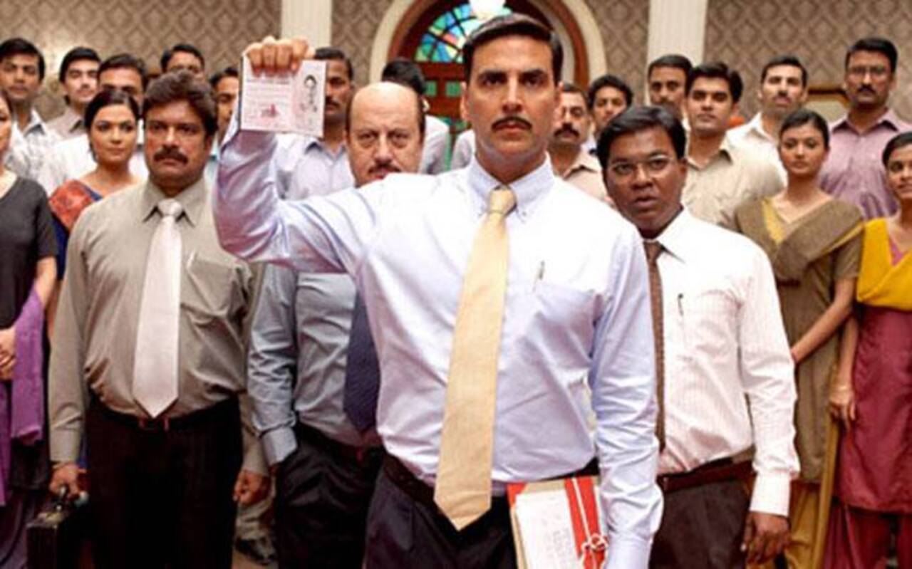 Special 26 (2013) 
Starring Akshay Kumar, Anupam Kher, Manoj Bajpayee, this Neeraj Pandey-directorial is based on the 1987 Opera House heist.  The plot follows a team of criminals (Akshay Kumar with Anupam Kher), who pose as CBI officers and conduct raids, robbing politicians and businessmen of their black money