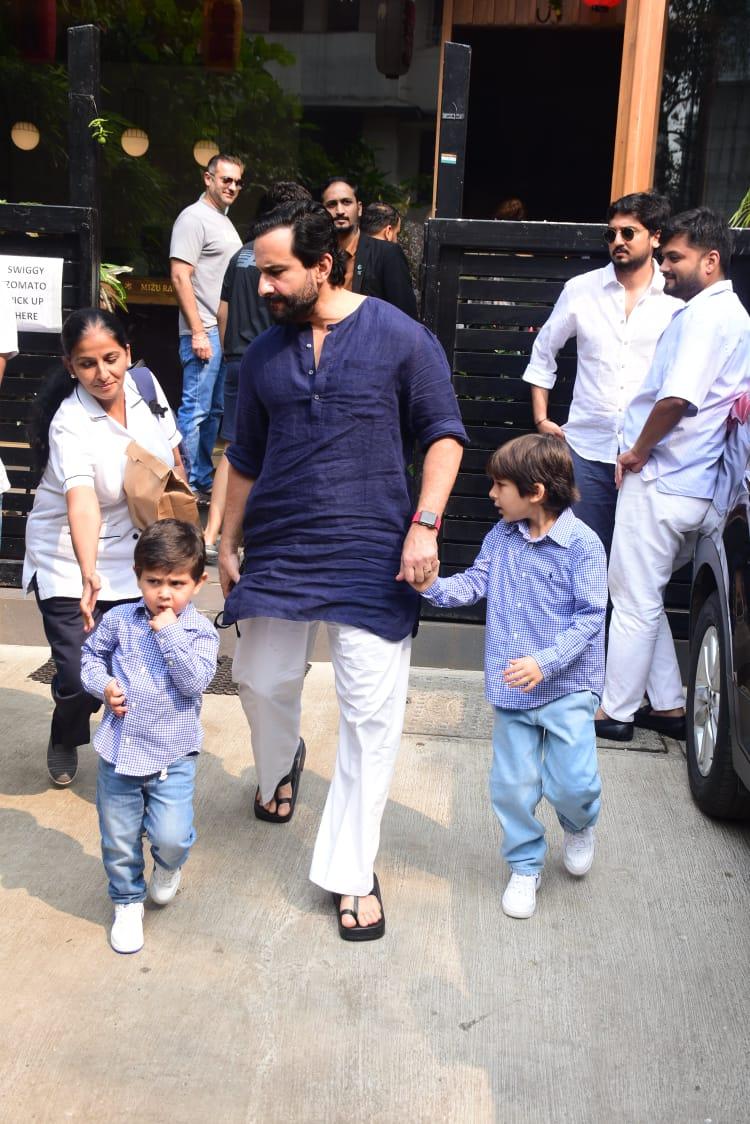 The father-son trio were dressed to match in blue ensembles