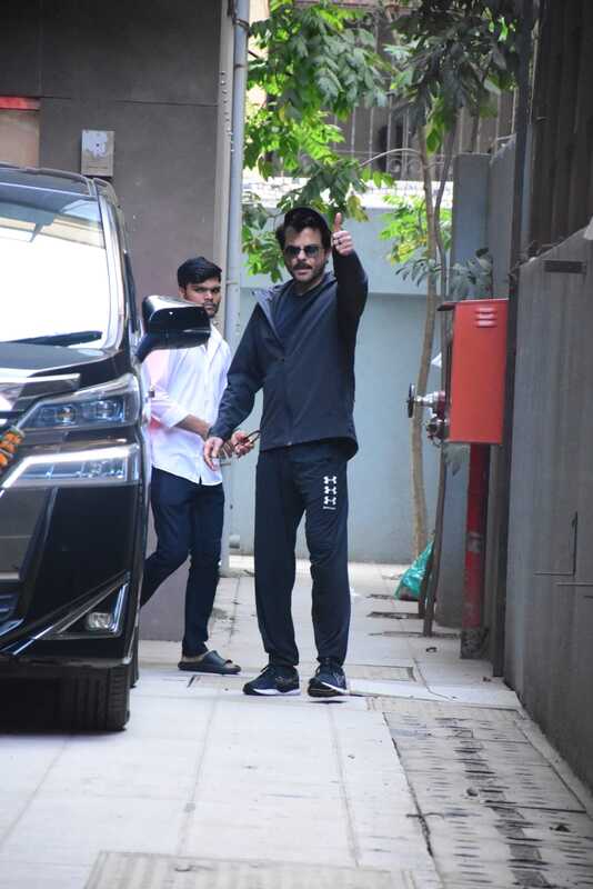 Anil Kapoor strikes a pose for the paparazzi as she steps out in the city