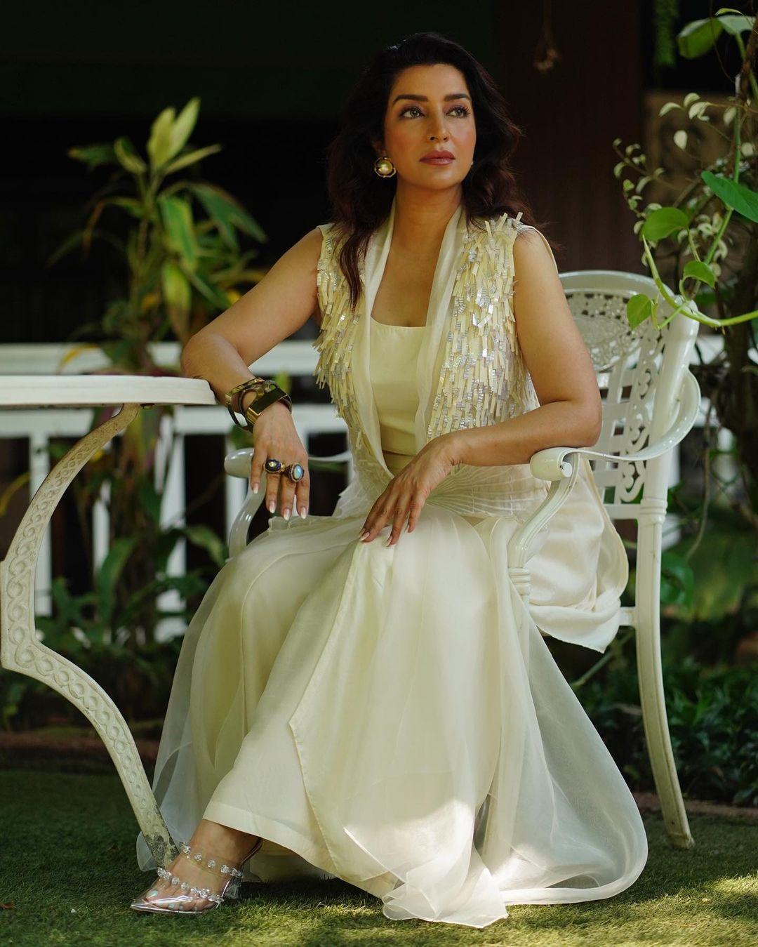 The contemporary two-piece ensemble featured a jacket adorned with elegant tassels, adding a touch of luxe to her look.