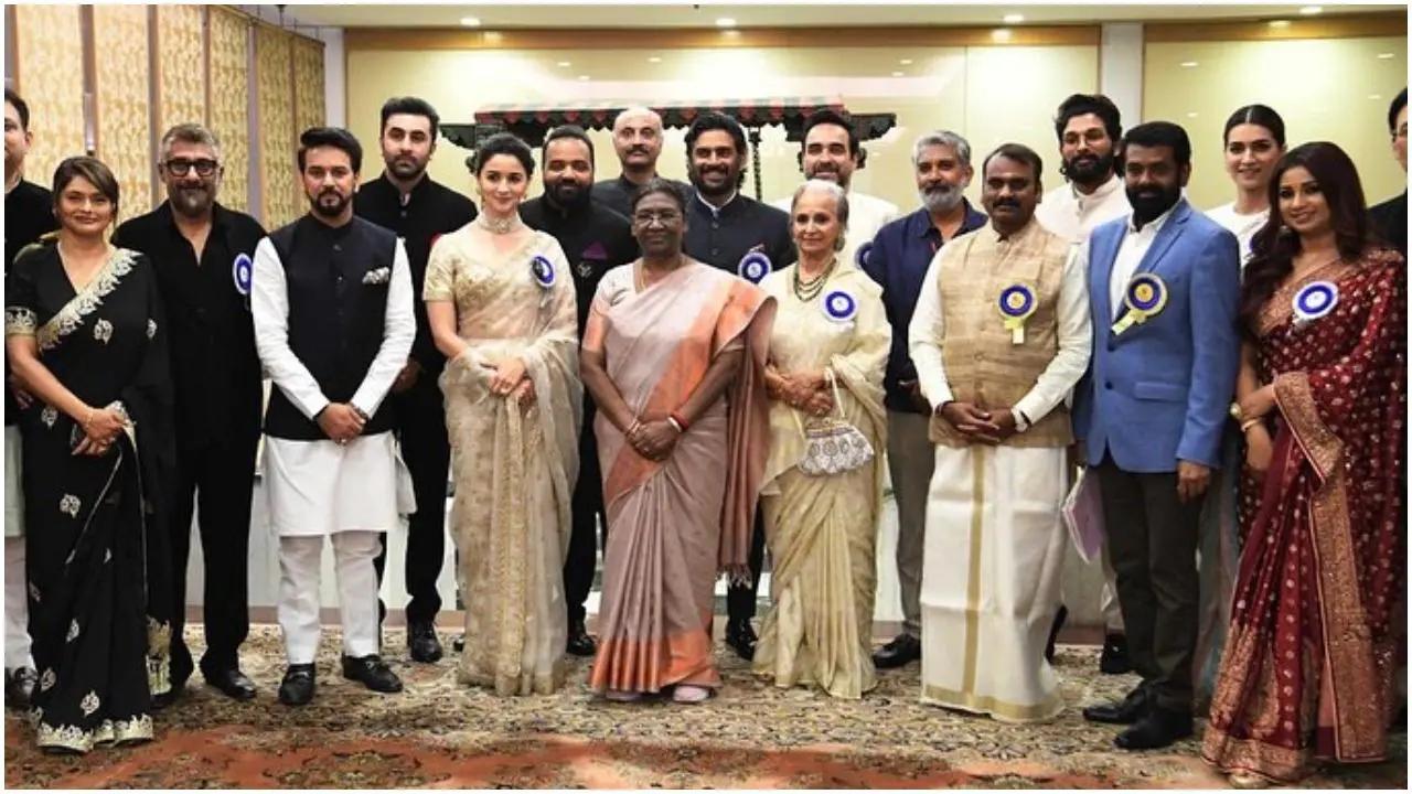 Vivek Agnihotri seemed to crop out Karan Johar in a group photo he shared of the winners at the 69th National Film Awards. Read More