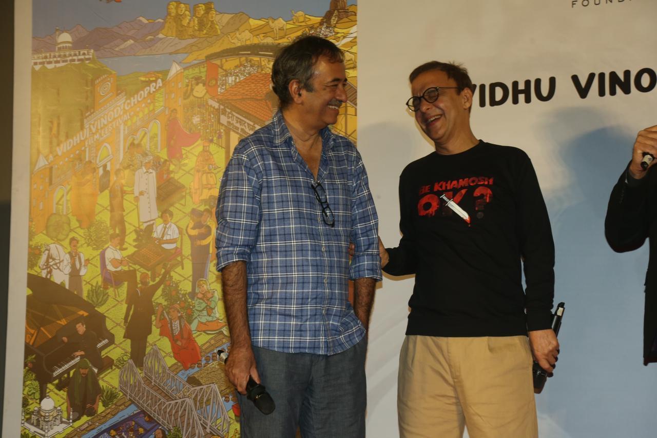 Frequent collaborators Rajkumar Hirani and Vidhu Chopra have a light-hearted moment amid the event