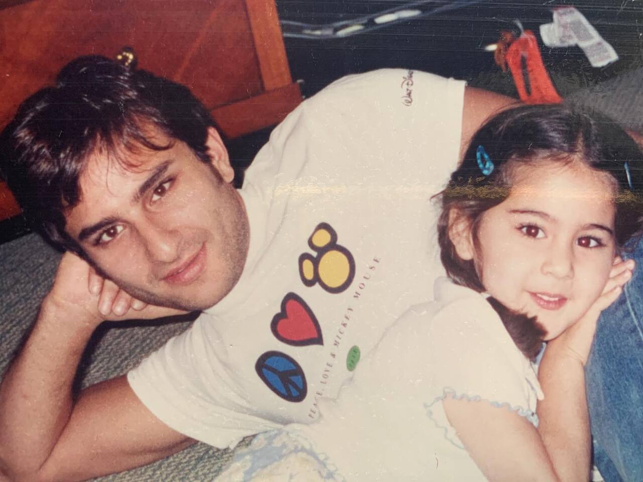 It doesn't get cuter than plump-cheeked Sara Ali Khan leaning against her 'Abba's' lap. A true pillar of support!